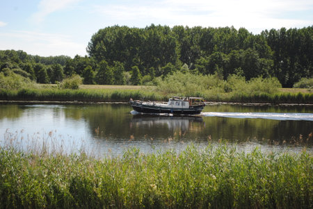 Boat on the river in the summer, Zwolle, The Netherlandsの写真素材