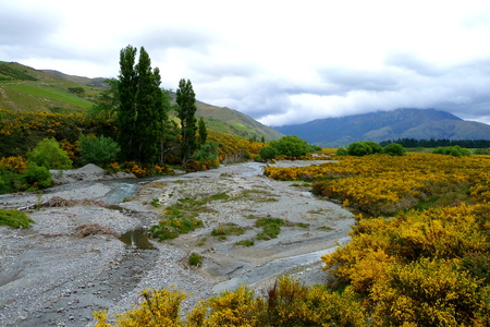 riverbed with mountains in the backgroundの写真素材