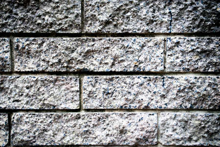 front view of a black - grey brick wall