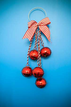 christmas baubles and bow on blue backgroundの写真素材