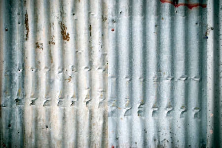 weathered corrugated iron wall backgroundの写真素材