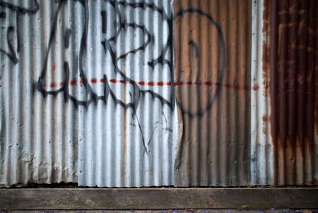 graffiti corrugated iron wall backgroundの写真素材