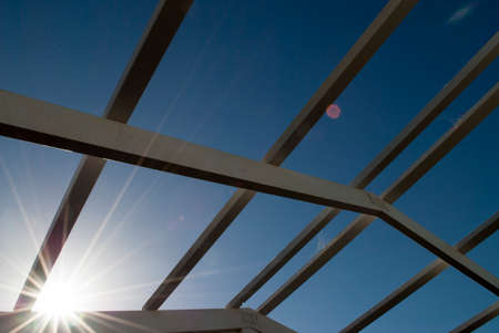 home extension timber frame with bright sunlight and clear blue sky