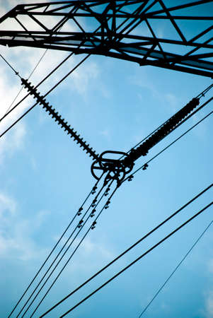 High voltage transmission tower with blue sky backgroundの写真素材