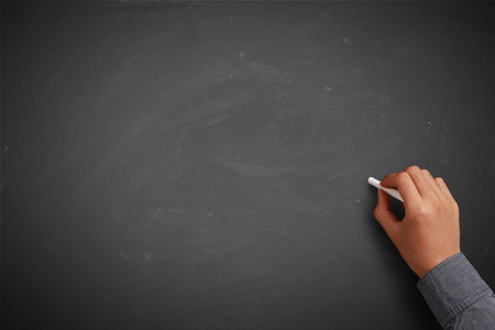 Hand writing on blank blackboard or background.の写真素材
