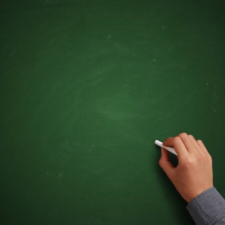 Hand writing on blank green chalkboard or background.の写真素材