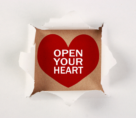 Open your heart on brown paper with white tear paper.