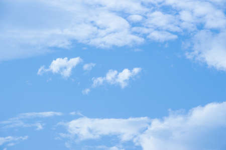Blue sky and white clouds background.