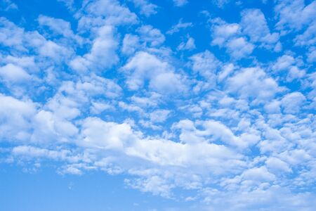 Blue sky and white clouds background.