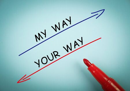 My way and your way concept is on blue paper with a red marker aside.の写真素材