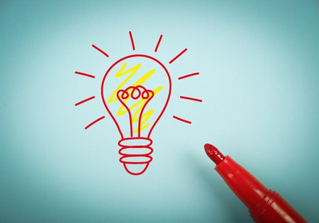 Big idea concept is on blue paper with a red marker aside.の写真素材