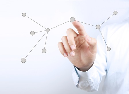 Businessman hand is pressing the social network.の写真素材