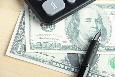 Dollar and some business objects is on the desk.の写真素材