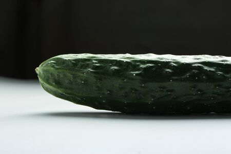 Closeup of a fresh cucumber is on the table.の写真素材