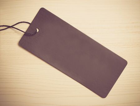 Blank label is on the wooden textured background.の写真素材
