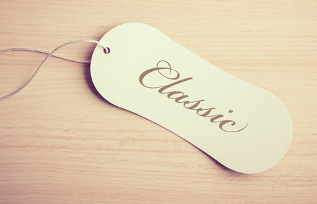Classic label is on the wooden desk background.の写真素材