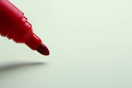 Red marker is drawing on the white background.