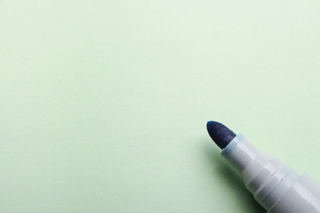 Marker is lying on the blank background with copy space.