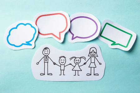 Paper people with colorful blank dialog speech bubbles. Social networking concept.