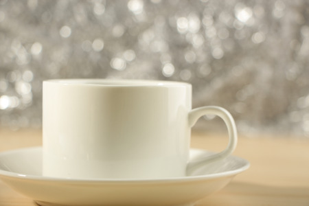 A cup of coffee isolated on a table with abstract backgroundの写真素材