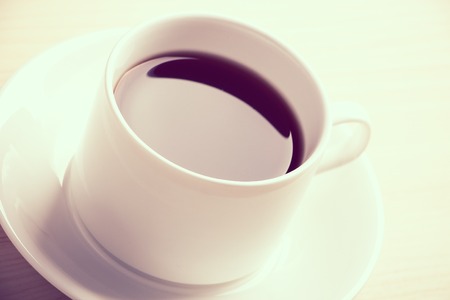 A cup of coffee is on the table.の写真素材