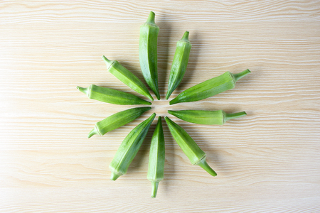 Fresh okra on the wooden table background.の写真素材