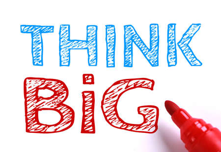Text Think big with red marker aside isolated on white paper background.の写真素材