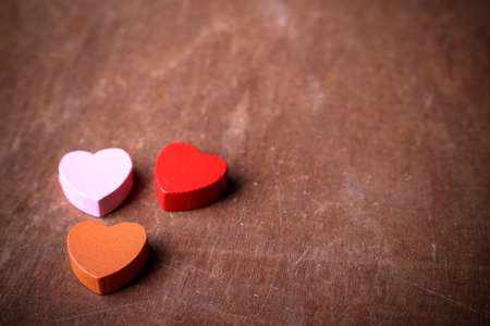 Blank wooden table with heart shape aside for valentine's day background.の写真素材
