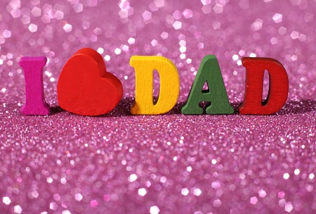 Colorful word I love dad standing on the glittering background.の写真素材
