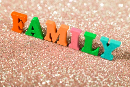 The colorful word Family on the glittering background.の写真素材