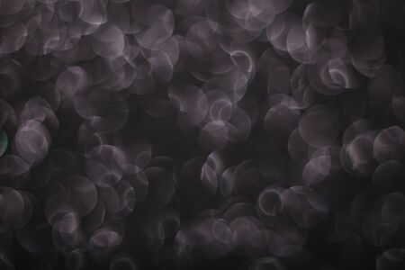 Bokeh glitter abstract background wallpaper for wedding and Christmas festival design.の写真素材