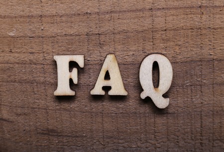 Wooden Text FAQ with rustic wooden background.の写真素材
