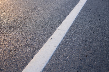 Closeup photo of the road with white line.の写真素材