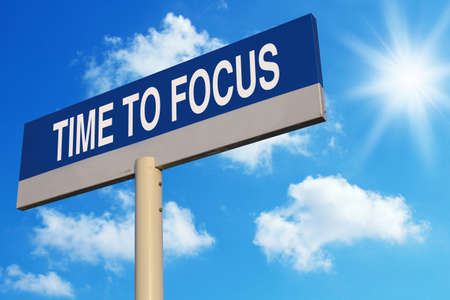 Time To Focus road sign with blue sunny sky background.