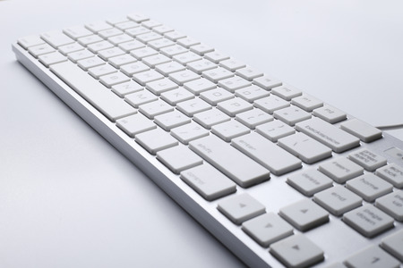Closeup picture of computer keyboard with white background.の写真素材