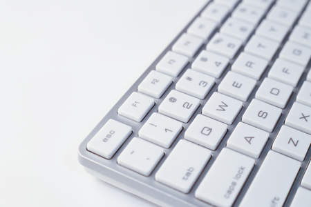 Closeup picture of computer keyboard with white background.の写真素材