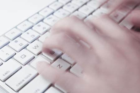 Closeup of typing businessman hand on computer keyboard.の写真素材