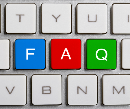 FAQ text on the colorful buttons of the keyboard.の写真素材