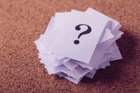 Closeup shot of a lot of paper with Question mark.の写真素材