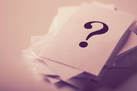 Closeup shot of a lot of paper with Question mark.の写真素材
