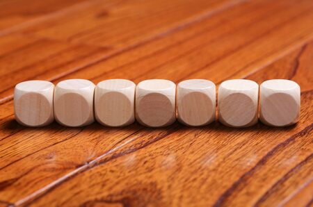 Wooden blocks are on the wooden floor background.の写真素材