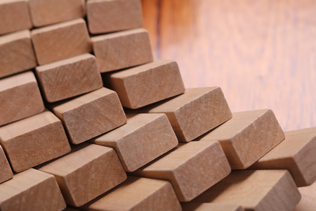 Wooden blocks are on the wooden floor background.の写真素材