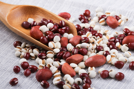 Many types of beans in wooden spoon.の写真素材