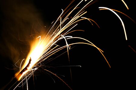 The beautiful fireworks light lines with black background.の写真素材