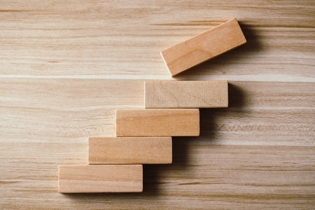 Step by step concept on the wooden desk background.の写真素材