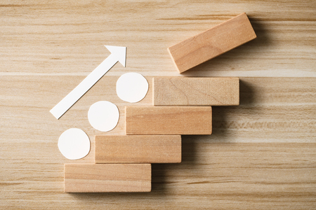 Step by step concept on the wooden desk background.の写真素材