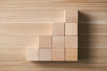 Step by step concept on the wooden desk background.の写真素材