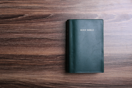 Holy bible on the wooden desk.の写真素材