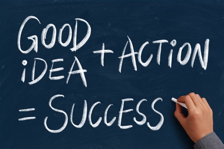 Business Success concept on the chalkboard with writing hand.の写真素材