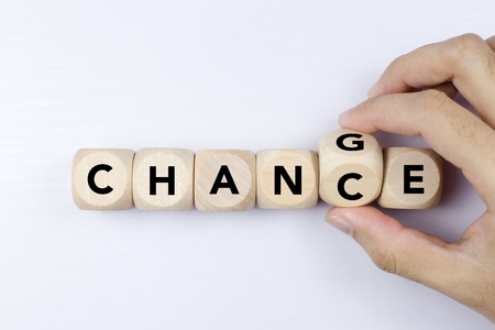 Wooden cube with word change to chance, Personal development and career growth or change yourself concept.の写真素材